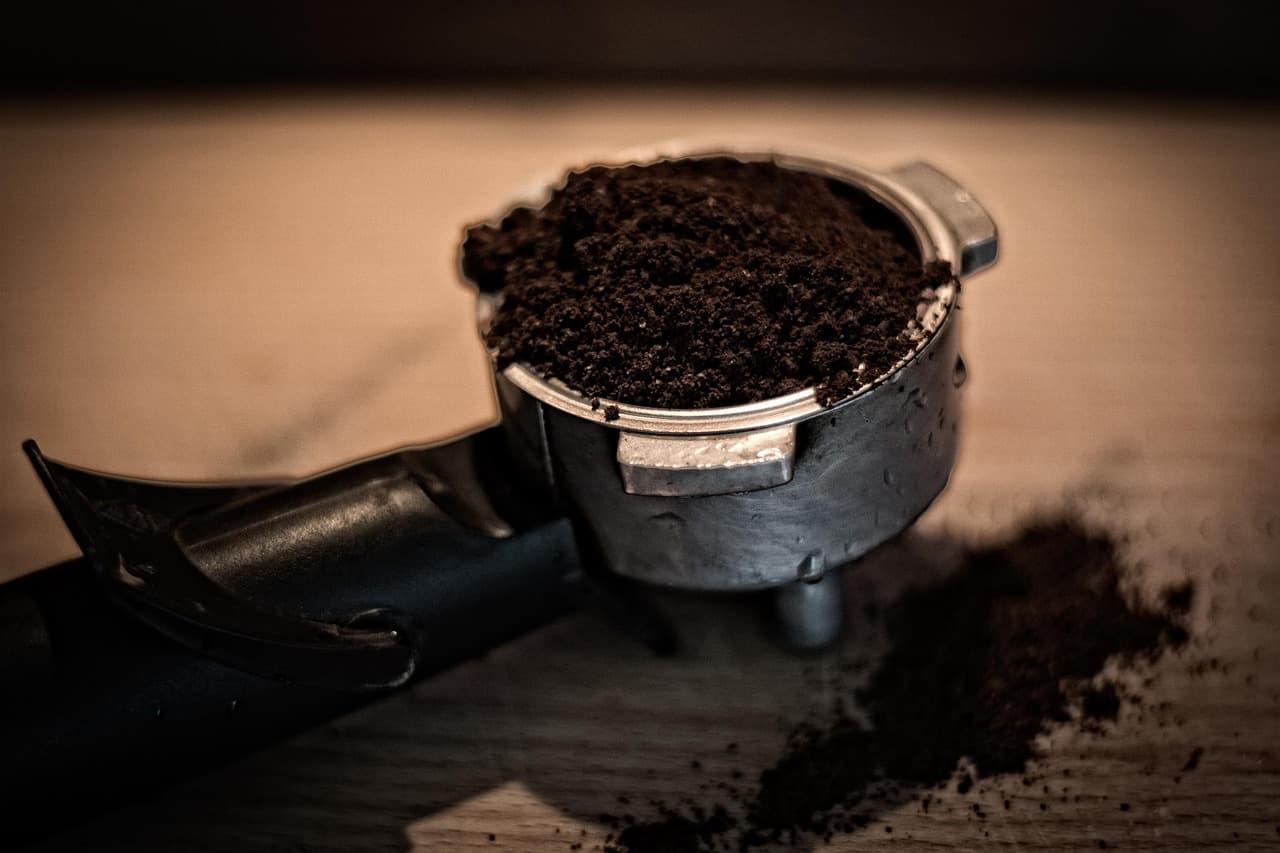 A portafilter packed with freshly ground coffee